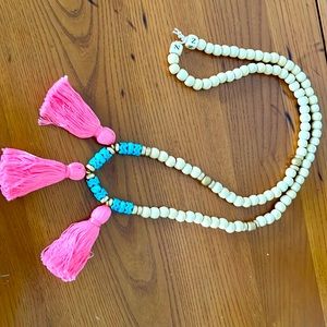 Bed and three tassel necklace
